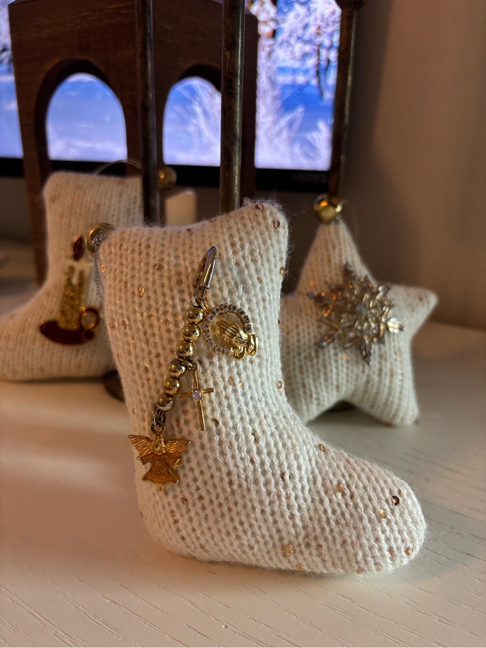Gold Charm Dangle brooch on Cream Knit Stocking Display